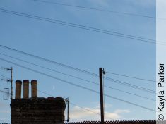 Kayla's photo of the young crescent moon just above the chimney, it's early evening