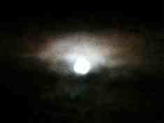 beautiful full moon with coloured ring