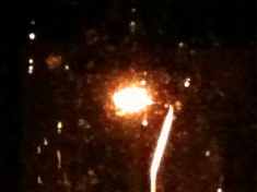 First photo of faux moon through rain, the streetlamp in the back lane