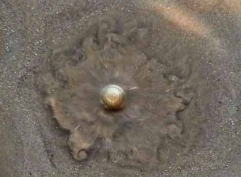 Frame taken from short film of water bubbling up through the sands of Morcambe Bay