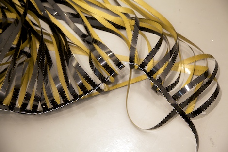 photo taken in the foyer of Scott Building, Plymouth University, showing STITCH 16mm sewn film artwork released from the walls