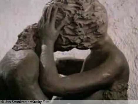 Still from Jan Švankmajer's film Dimensions of Dialogue: part 2 - clay figures of a man and a woman mingle in a erotic embrace